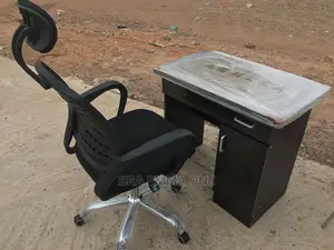 Brand New Office Chair With Neck Rest and a Table