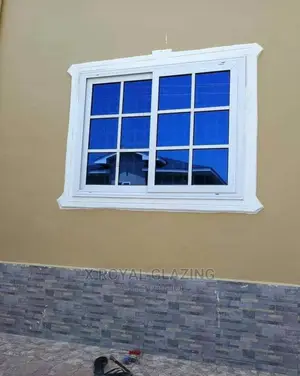 White Divisions With Blue Glass Sliding Windows