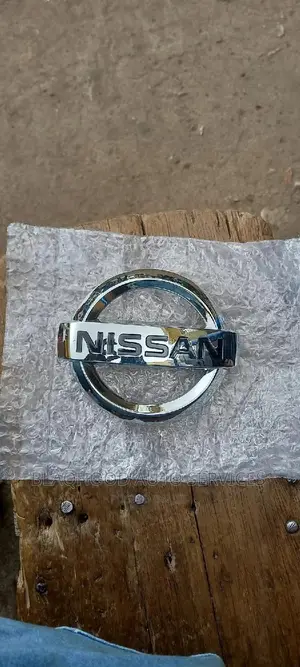 Nissan Sentra/Versa Front CROWN/EMBLEM in Stock