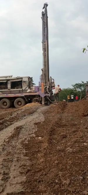 Borehole Drilling Services With Quality Pump and Blue Pipes