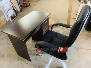 Brand New Leather Swivel Chair and a Table