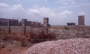 A Titled Plot of Land for Sale.