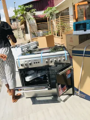 Stainless Steel Midea 60x90 5 Gas Burner With Oven Grill.