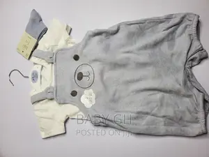 Goerge Baby Brace Jumper and White Top With a Pair of Socks