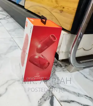 Elegant Red JBL Flip 6 Bluetooth Speaker.