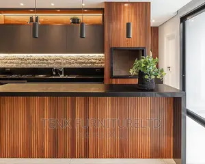 Kitchen Cabinet With Built Island and Stone Top