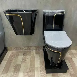 Black And Gold Water Closet With Hanging Basin