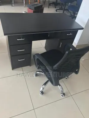 A Set of Office Table With Office Chair Headrest.