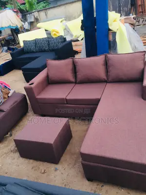 Neat Wine Color L Shaped Sofa Chair With Center Table