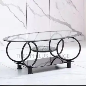 Glass Center Table With Round Base Design.