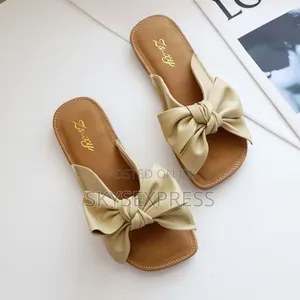 Ladies Slippers With a Bow Tie