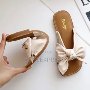 Ladies Slippers With a Bow Tie