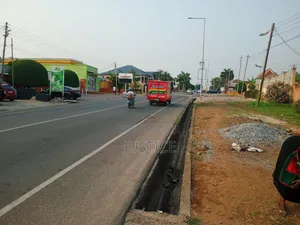1 Acre Land on Side of Main Road West Legon