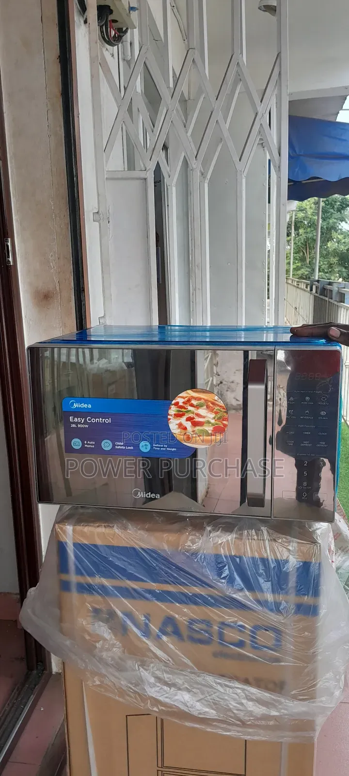 Shiny New Midea Cooking Microwave 25L