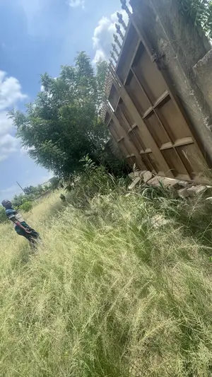Wall and Gated 4 Plots of Land for Sale at Amasaman .