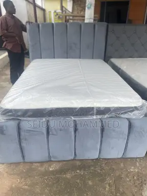 A Double Standard Bed Frame With Mattress