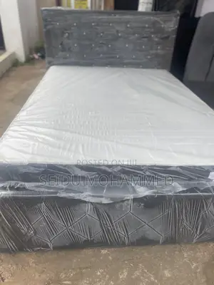 A Double Bed Frame With Mattress