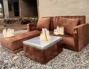 L - Shaped Sofa Chair With Quality Pillows and Polished Center Table