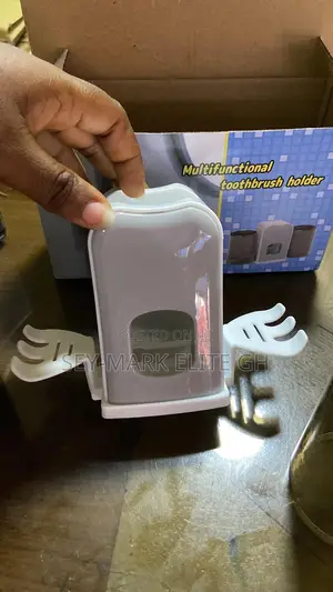 Automatic Toothpaste Dispenser And Brush Holder