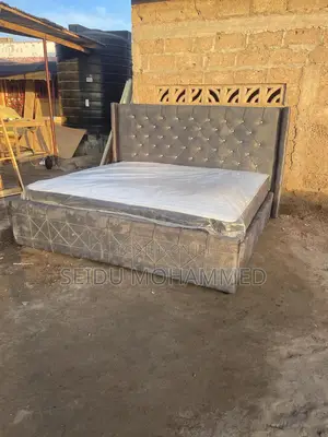 A Kingside Bed Frame With a Mattress