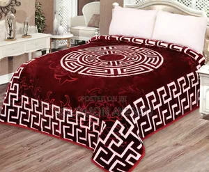 Quality Korean Mink Blanket With a Blue and White Greek Key Pattern.