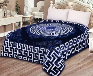 Quality Korean Mink Blanket With a Blue and White Greek Key Pattern.