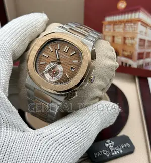 Patek Philippe Two Tone Stainless Steel Nautilus Watch  Black Dial.