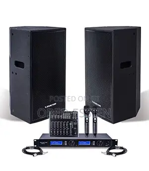A Pair of JBL Speakers With Amp and Microphone