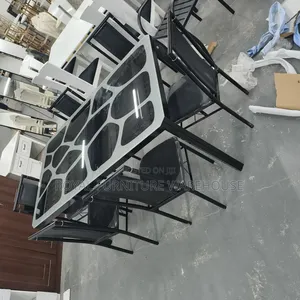 Modern Metal and Glass Dining Table Set With Six Black Chairs