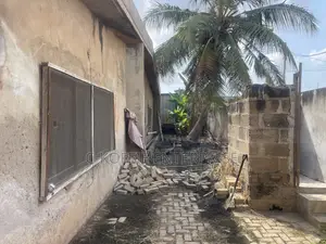 Old Structure on 1 and Half Plot at Achimota for Rent