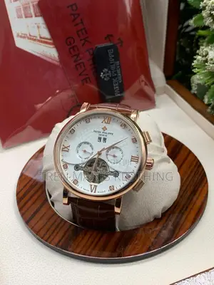 Gold Brown Leather Patek Philippe Automatic Watch White Surface
