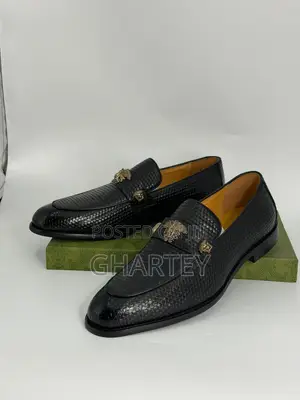 Luxury Textured Leather Loafers With Gold Crest Detail