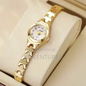 Elegant Golden Quartz Watch With Unique Link Design