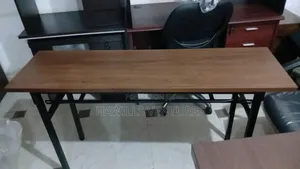 Foldable Banquet Table Featuring a Mahogany Melamine Top.