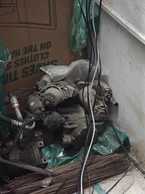 Assorted Auto Parts Nissan and Chrysler Starter, Ac Compressor Etc