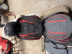 Two Front Leather Seat Covers With Black and Red Design