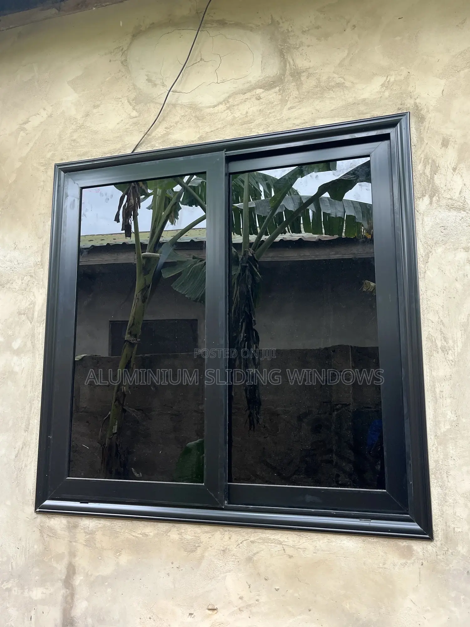 Black Frame and Dark Glass Sliding Windows With Net and Locks