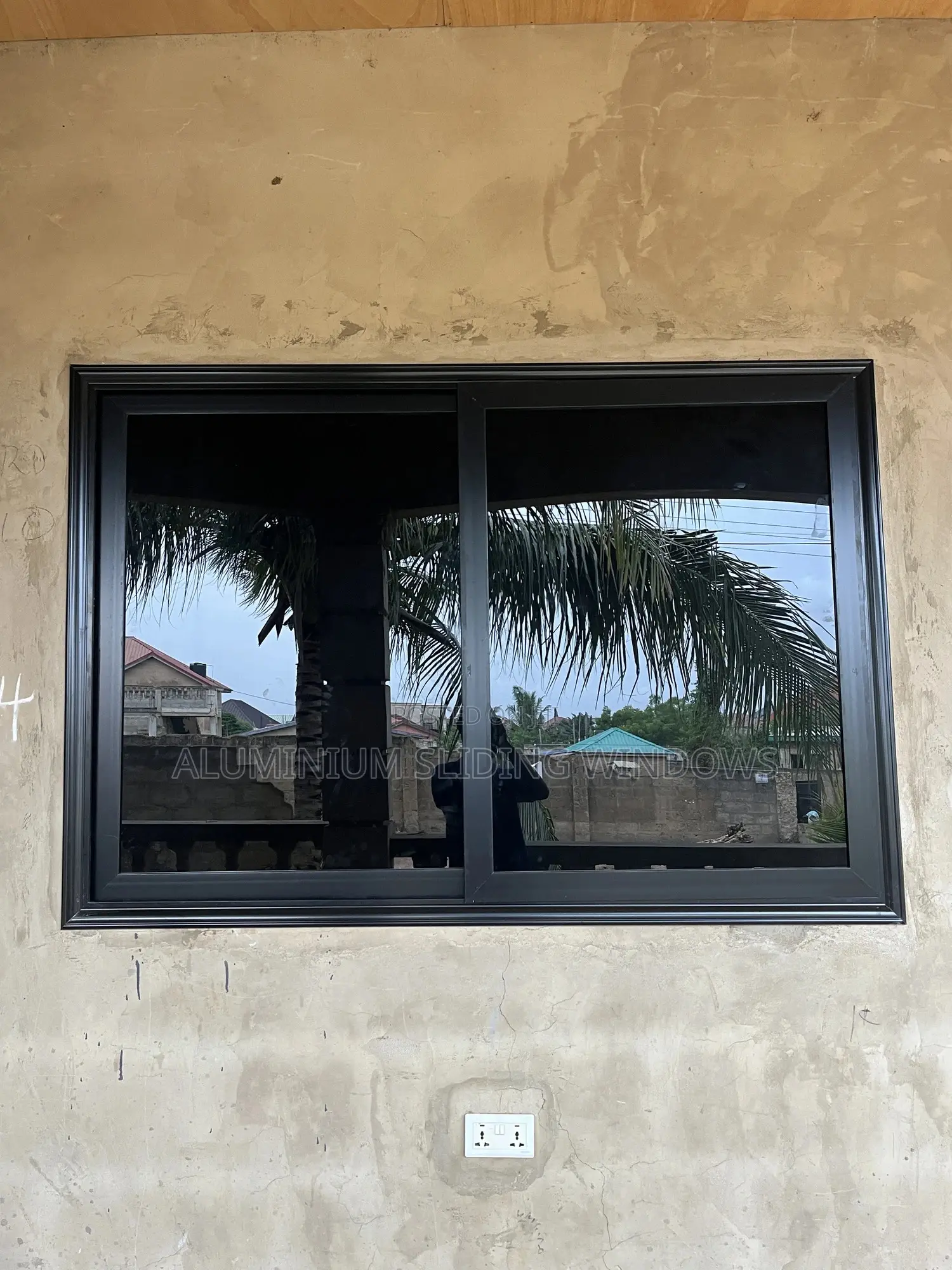 Black Frame and Dark Glass Sliding Windows With Net and Locks