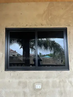 Black Frame and Dark Glass Sliding Windows With Net and Locks
