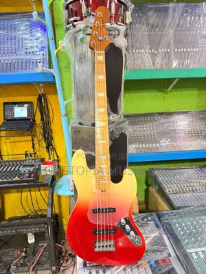 Fender Sqoe 5-String Electric Bass Guitar With a Sunrise Fade Finish.