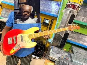 Fender Sqoe 5-String Electric Bass Guitar With a Sunrise Fade Finish.