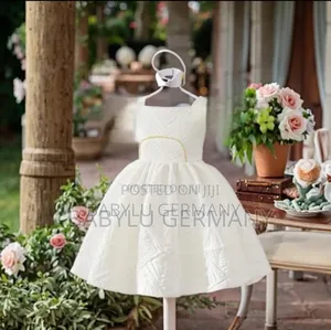 White Girl's Dress With Gold Pattern