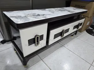 Modern Tv Stand Features White and Gray Faux Marble Top