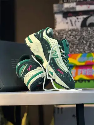 New Balance 1000 Sneakers (Green/White Colorway).