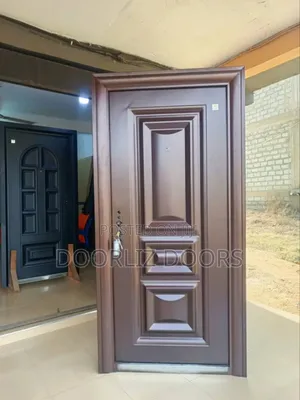 Brown Single Security Door With Keys,Handles And Frames.