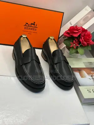 Hermès Black Leather Penny Loafers