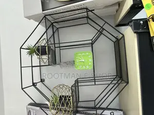 Gold-Colored Geometric Wire Planters Containing Artificial Succulent