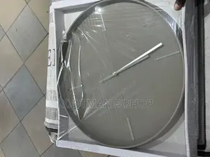 Circular Wall Clock Featuring a Minimalist, Grey-Toned Design