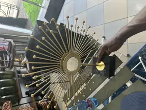 Golden Sunburst Table Sculpture With a Polished Finish