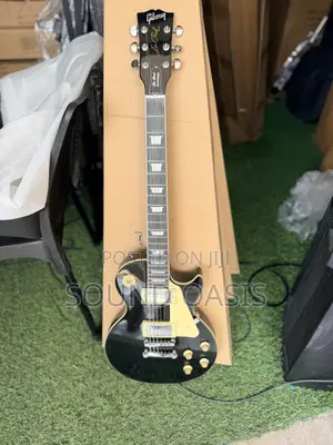 Black Gibson Les Paul Standard Electric Guitar.